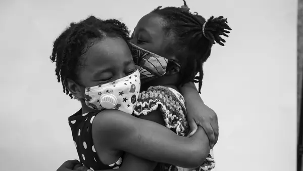 Friends Kennedy (left) and Amina reunited at the Children's March outside the Brooklyn Public Library in June, 2020. 