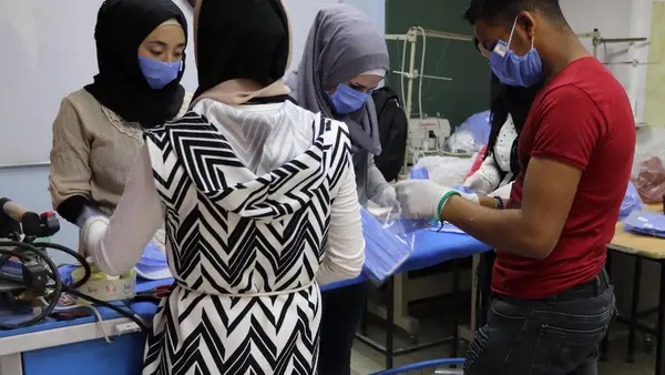 A UNICEF-supported youth center in Jaramana, Damascus, Syria trains young people to sew facial masks to protect children and families from COVID-19.