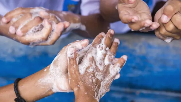 Person Washing Hands COVID