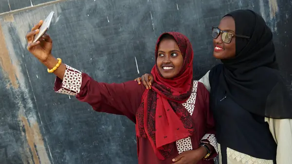 Two People Taking a Selfie