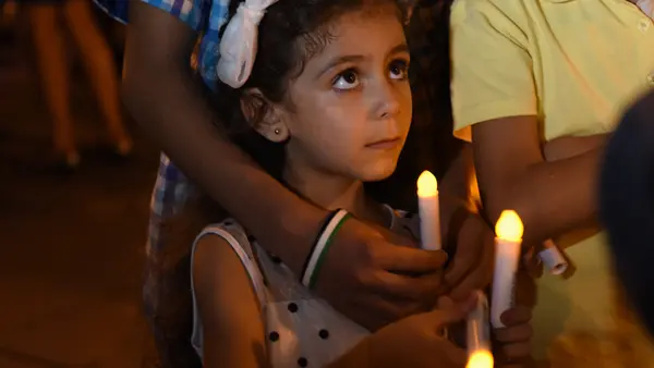 A young girl from Syria attends a candlelight vigil for child refugees at Dag Hammarskjold Plaza in New York City in September 2016.