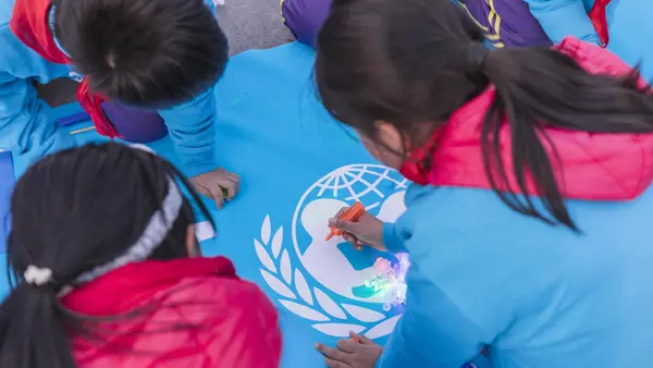 Children from Beijing write down their wishes to share with peers around the world at the Olympic Park in Beijing, China, on 20 November 2019.