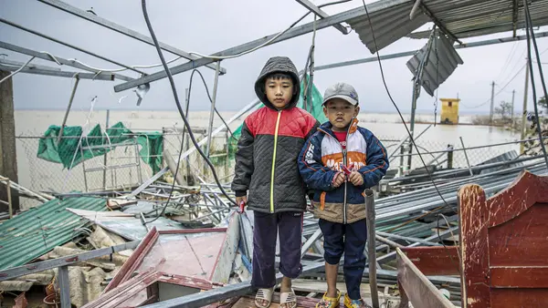 Two Children Posing in the Rain