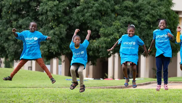 Koumba, Jean Uriel, Mariam and Yasmine jump for joy before World Children's Day 2020 in Abidjan, Côte d'Ivoire.