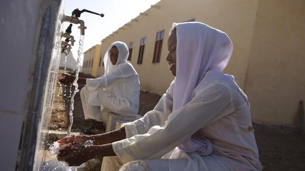 Women Washing Hands