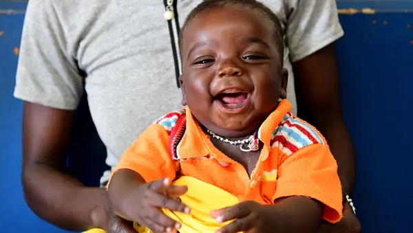 Soro Issuf, a 5 months old happy boy is waiting for his turn for being vaccinated, in the Regional Hospital of Korhogo, in the North of Côte d'Ivoire.
