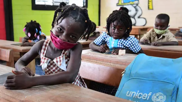 Children attending classes in Toumodi-Sakassou, in the center of Côte d'Ivoire.   Due to COVID-19, the schools were closed for several weeks. Classes started, with the necessary measures. Children wear masks, wash their hands regularly and keep a social d