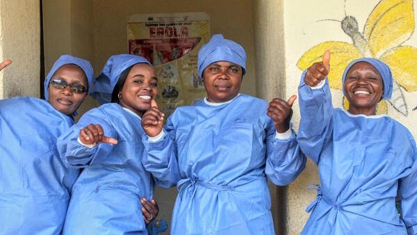 UNICEF-supported health workers celebrate the end of the Ebola outbreak in eastern Democratic Republic of the Congo in June 2020.
