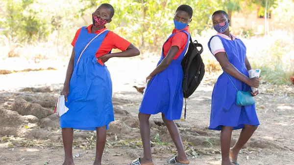Students take a break outside the UNICEF-supported Luwambaza primary school in Nkhatabay district, northern Malawi in 2020.