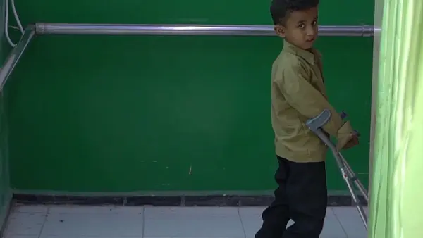 Child Walking with Crutches