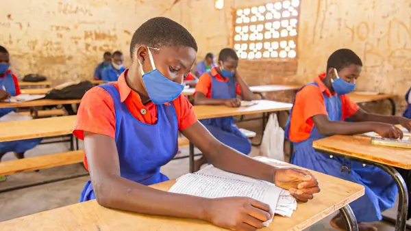 Having a desk helps students in Malawi maintain social distancing and prevent spread of COVID-19.