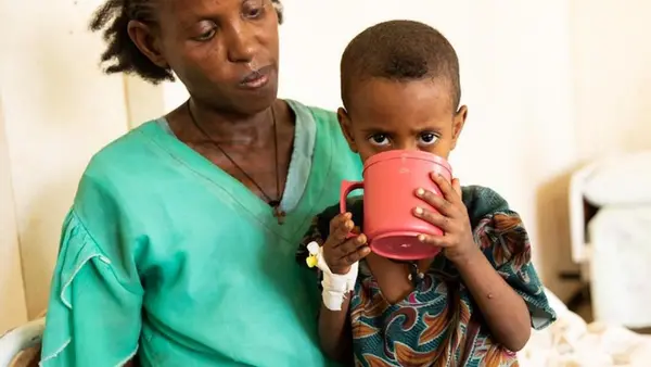 A child suffering from acute malnutrition drinks therapeutic milk provided by UNICEF as part of the ongoing humanitarian response in Ethiopia's Tigray region.