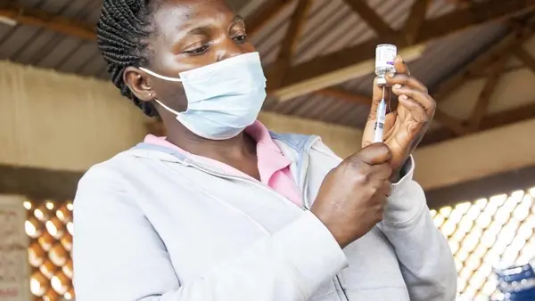 n Uganda on October 19, 2021, Mary Namirembe, a nurse at Masaka Regional Referral Hospital, fills a syringe with COVID-19 vaccine. 