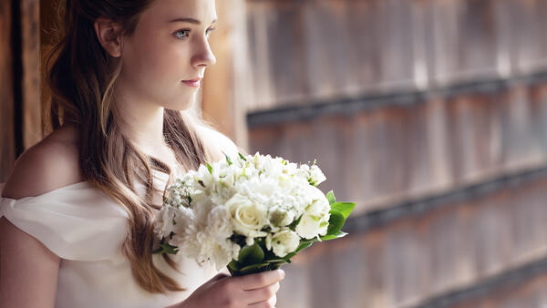Girl in White Dress with Flower Bouquet