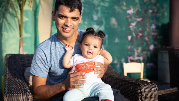 A father and daughter from Argentina who recently received support from Jewish Family Service of San Diego, part of the Rapid Response Network working in the San Diego border region to protect the rights of asylum seekers.