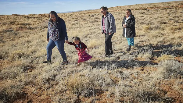 Three generations of a family, citizens of the Navajo Nation, are photographed in Central Chinle Agency in Arizona.