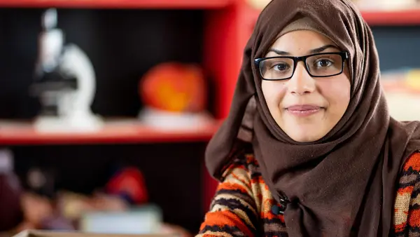 Bodoor, 17, in the science lab of her UNICEF-supported school in Jordan in 2018. She and her family fled violence in Syria and settled in Azraq Refugee Camp since 2014. 