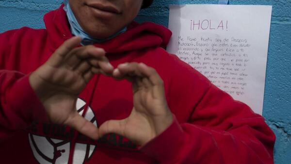 A boy reacts to a letter of support he received from another Mexican teenager at a shelter for unaccompanied migrant adolescents in Tijuana, Mexico. 