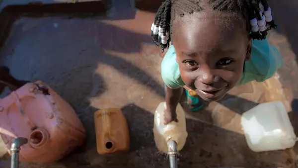 Five-year-old Queen Philip collects water at a UNICEF-supported water point in Yambio, South Sudan.