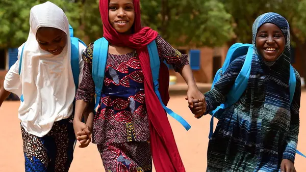 Children head for home after a day of school in Niamey, the capital of Niger, in 2021.