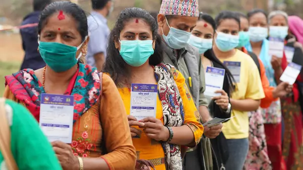 Health workers lined up to receive their second dose of COVID-19 vaccine at the Palungtar Community Health Center in Gorkha District in north-central Nepal on April 21, 2021. 