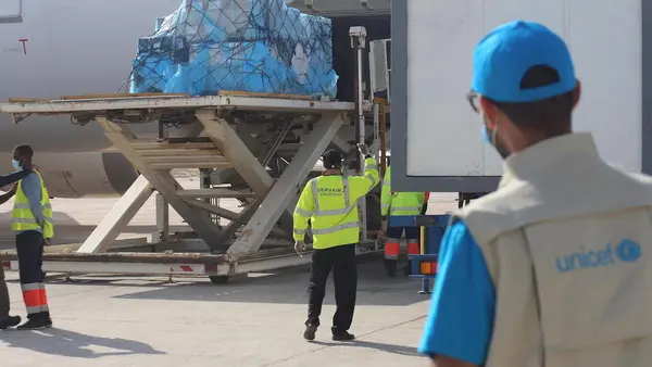 A UNICEF staff member works with partners to facilitate the delivery of a new shipment of 31,200 additional doses of Covid-19 vaccine on April 26, 2021 to Nouakchott International Airport in Mauritania as part of the COVAX initiative.