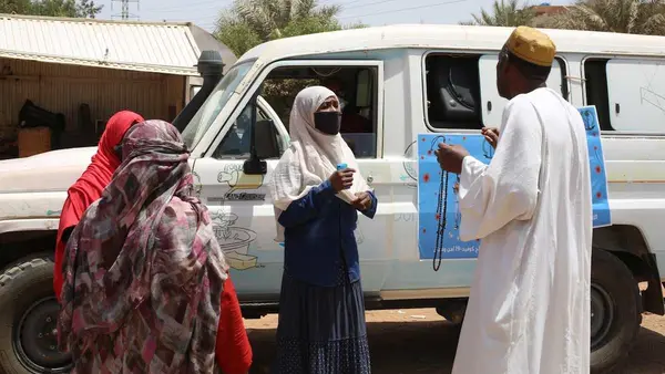 People Talking Near Car