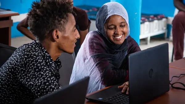 Two People on Laptops