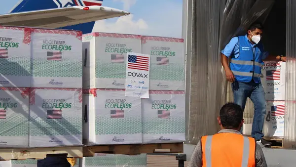 Vaccines are loaded into refrigerated trucks after 1.5 million doses of COVID-19 vaccines donated by United States Government via COVAX’s dose-sharing mechanism arrived at Armando Escalón Espinal Air Base, San Pedro Sula Airport, Honduras on June 27, 2021