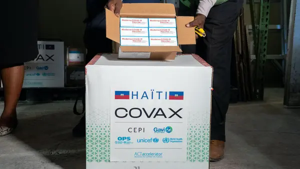 COVID-19 vaccine doses, donated by the U.S. government as part of the COVAX dose-sharing program, arrive in Port-au-Prince on July 13, 2021.