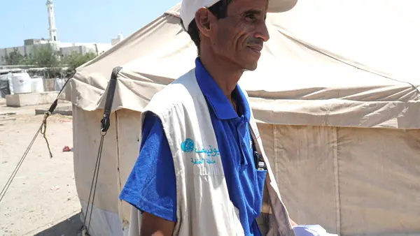   Yahya Ahmed Ganem Al Sofy works as a UNICEF community outreach worker sharing  hygiene information to prevent the spread of COVID-19 in Al Sha'ab IDP (short for internally displaced persons) camp in Aden, Yemen. 