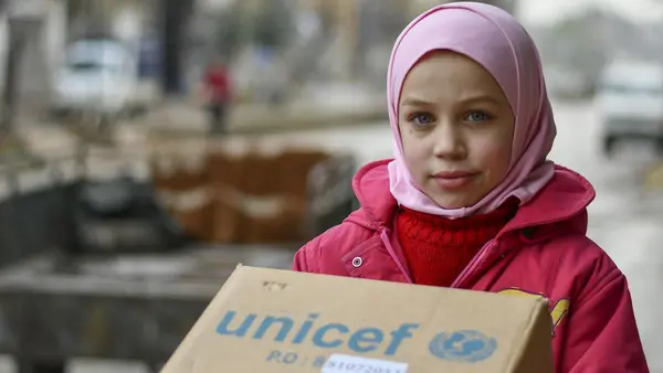 Najwa, 10, received new winter clothes from UNICEF in Hammourieh, rural Damascus in the Syrian Arab Republic.