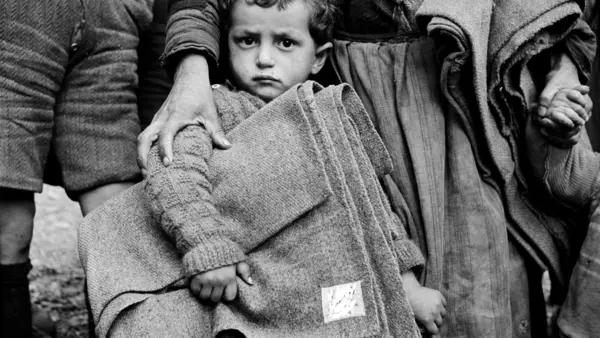 Young Child Holding Blanket