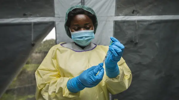 Person Preparing Vaccination
