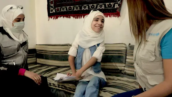 A home visit with 11-year-old Bara'a of Douma, Syria, a quadriplegic who is thriving with support from UNICEF.