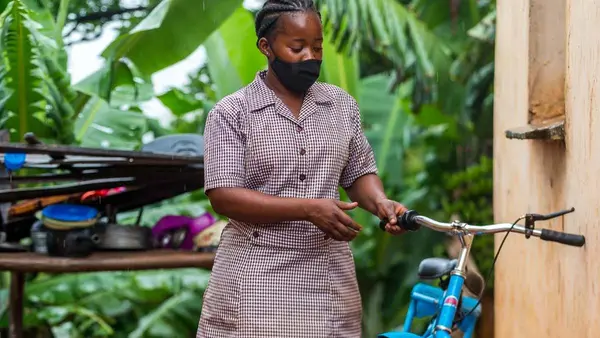 Reaching the 186 households in her Dimire village close to the Mozambican border is now much easier for UNICEF-supported village health worker Miranda Muyambo since receiving a bicycle in April 2020. UNICEFZimbabwe/2021/Timothy Manyange