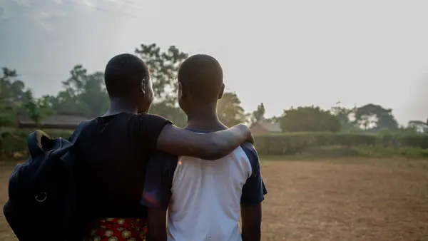 Young Adults with Arms Around Eachother