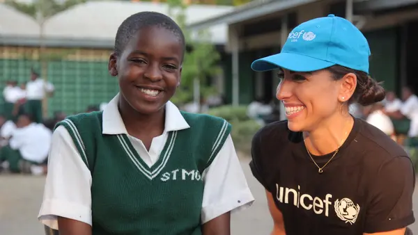 K.I.N.D. Fund scholarship student Isroella, 14, and Nina Marie Costa, UNICEF USA Deputy Director of Public Relations, at St. Monica Secondary School in southern Malawi.