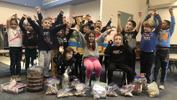 Group of Children with Arms Raised