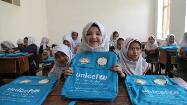Girls at an elementary school in Mazar, Afghanistan received UNICEF schoolbags and learning supplies. 