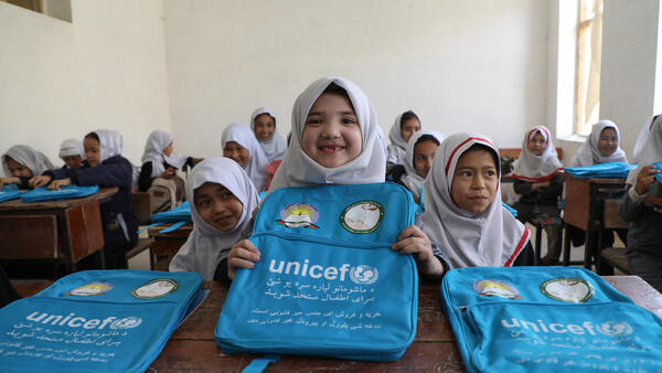 Girls at an elementary school in Mazar, Afghanistan received UNICEF schoolbags and learning supplies. 