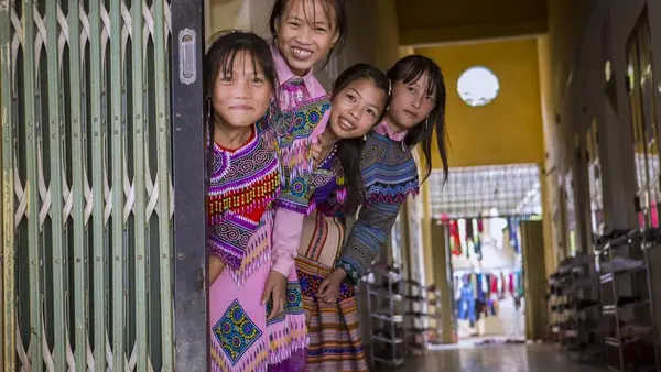 A group of Grade 7 students gather in the entryway to UNICEF-supported Sin Cheng secondary school in Vietnam.