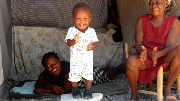 Toddler Standing on a Cinder Block
