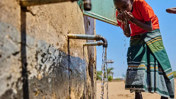 A child drinks water piped from a borehole rehablitated by UNICEF in Garissa County, Kenya. 