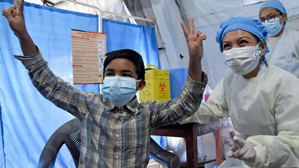 Thirteen-year-old Ashutosh Chhetry received his first dose of COVID-19 vaccine, delivered by UNICEF via COVAX, in Lalitpur District, central Nepal on December 14, 2021.
