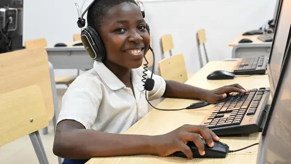A student works in the computer room at Lycée Mamie Adjoua in Bingerville, southern Côte d'Ivoire on February 11, 2022. 
