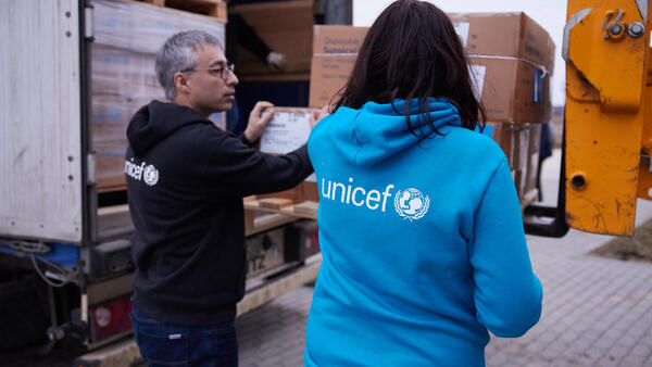 Murat Sahin, UNICEF's Representative in Ukraine, left inspects medical and other emergency supplies shipped from UNICEF’s Global Supply and Logistics Hub in Copenhagen upon arrival in Lviv on March 5, 2022..