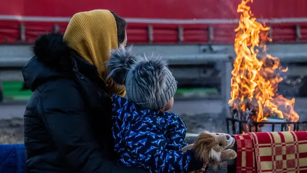 Adult and Child Observing Fire