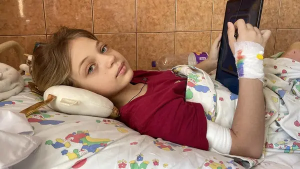 11-year-old Yana, who lost two legs during a missile attack at Kramatorsk railway station, recovers at a hospital in Lviv, Ukraine.