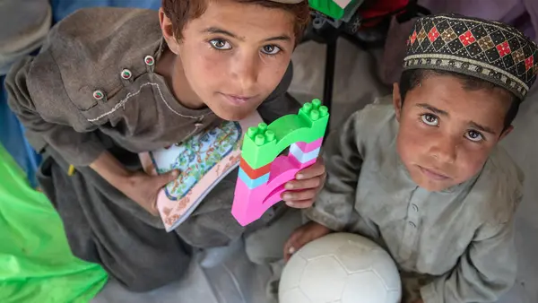 Abdul, 8, and Zolgi, 7, play with blocks and balls in a UNICEF-supported Child-Friendly Space in Gayan district, Paktika province, Afghanistan.